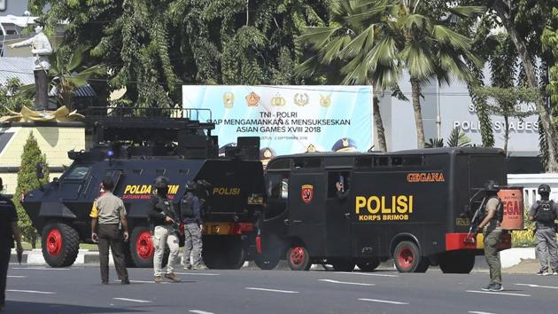 Police vehicles are parked outside local police headquarters following an attack in Surabaya, East Java, Indonesia, Monday, May 14, 2018. (AP) Police vehicles are parked outside local police headquarters following an attack in Surabaya, East Java, Indonesia, Monday, May 14, 2018. (AP)