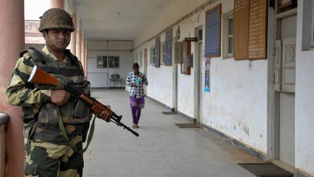 A securityman stands guard outside a room where Electronic Voting Machines (EVMs) are kept, at Chikmagalur in Karnataka on Monday. Results for Karnataka assembly elections will be declared on Tuesday.(PTI Photo) A securityman stands guard outside a room where Electronic Voting Machines (EVMs) are kept, at Chikmagalur in Karnataka on Monday. Results for Karnataka assembly elections will be declared on Tuesday.(PTI Photo)