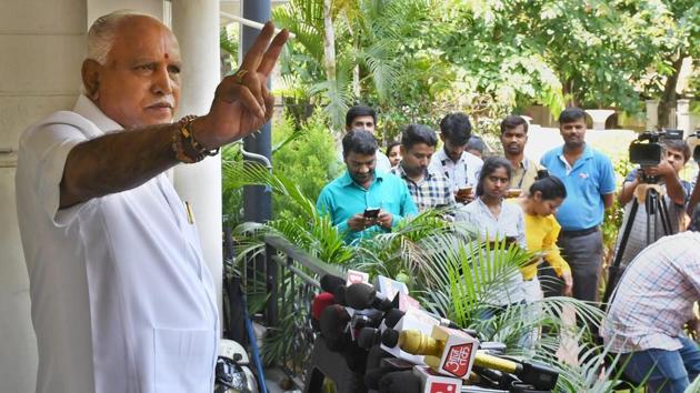 BJP leader B S Yeddyurappa shows the victory sign during a press conference in Bengaluru on Sunday, a day after polling for Karnataka elections.(PTI) BJP leader B S Yeddyurappa shows the victory sign during a press conference in Bengaluru on Sunday, a day after polling for Karnataka elections.(PTI)