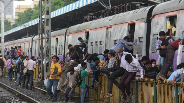 Railways had put up barricades at many places between the tracks to prevent track crossing. Nevertheless, the commuters continue to cross the tracks illegally, officials say.(HT FILE)
