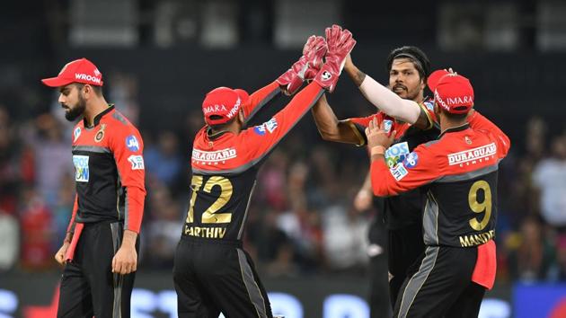 Umesh Yadav picked up 3/23, including the wickets of KL Rahul and Chris Gayle cheaply as Royal Challengers Bangalore thrashed Kings XI Punjab by 10 wickets to stay alive in the race for the play-offs.(AFP)