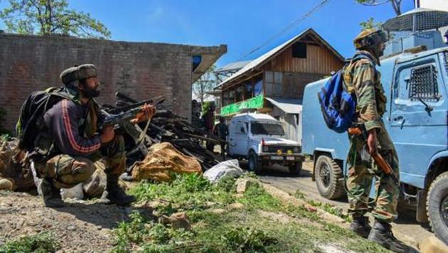 Security personnel stand guard during an encounter between security forces and militants in South Kashmir.(PTI File Photo)