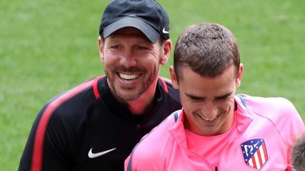 Atletico Madrid coach Diego Simeone and Antoine Griezmann (Right) during training ahead of their Europa League final match vs Marseille.(REUTERS)