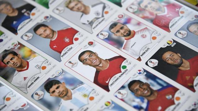 A collectible card of Portugal forward Cristiano Ronaldo (C) among other players for the 2018 Russia football World Cup at the Panini Group factory in Modena, Italy. Between eight and ten million packets a day, each with five cards, perhaps including the coveted ones of Lionel Messi, Neymar or Cristiano Ronaldo -- as World Cup fever builds the Panini sticker factory is working flat out. (Marco Bertorello / AFP)