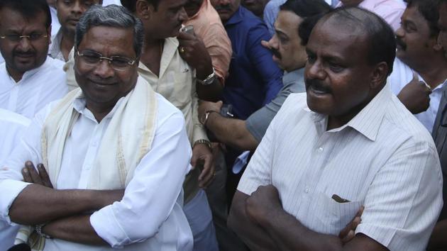 Former Karnataka state chief minister Siddaramaiah (Left) and Janata Dal (Secular) leader H D Kumaraswamy stake their claim to form the next Karnataka government in Bangalore on Tuesday.(AP)