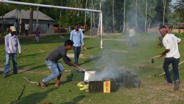 Miscreants burn a ballot box during panchayat elections, at Malda district in West Bengal on Monday. (AFP) Miscreants burn a ballot box during panchayat elections, at Malda district in West Bengal on Monday. (AFP)