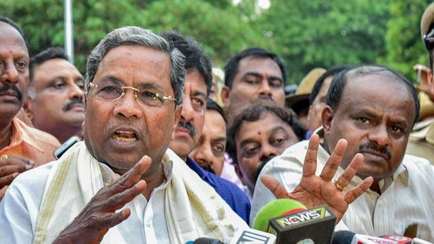 Outgoing Karnataka chief minister Siddaramaiah and JD(S) president HD Kumaraswamy address the media after a meeting with governor Rudabhai Vala after assembly election results,in Bengaluru on Tuesday. (PTI Photo) Outgoing Karnataka chief minister Siddaramaiah and JD(S) president HD Kumaraswamy address the media after a meeting with governor Rudabhai Vala after assembly election results,in Bengaluru on Tuesday. (PTI Photo)
