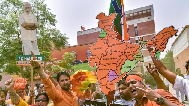 BJP workers celebrate the party's lead during counting of votes for Karnataka Assembly elections, at the party headquarters in New Delhi.(PTI Photo) BJP workers celebrate the party's lead during counting of votes for Karnataka Assembly elections, at the party headquarters in New Delhi.(PTI Photo)