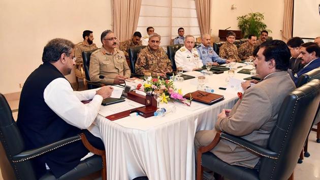 Pakistan's Prime Minister Shahid Khaqan Abbasi (left) heads a meeting of the National Security Committee in Islamabad after his predecessor sparked a firestorm after suggesting Pakistani militants were behind the 2008 Mumbai attacks.(AFP)