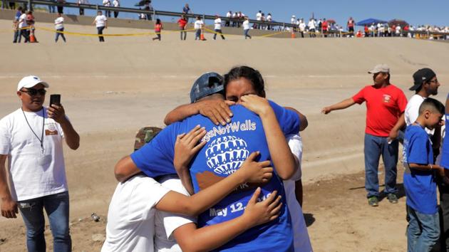 The fifth event of its kind saw the reunions take place at the river boundary that separates the Mexican city of Ciudad Juarez, from El Paso, Texas. At the event more than 300 families all donned blue shirts, while their counterparts from the Mexican side wore white to ensure no one tried to slip across. The reunions were approved by US government agencies. (Lucas Jackson / REUTERS) The fifth event of its kind saw the reunions take place at the river boundary that separates the Mexican city of Ciudad Juarez, from El Paso, Texas. At the event more than 300 families all donned blue shirts, while their counterparts from the Mexican side wore white to ensure no one tried to slip across. The reunions were approved by US government agencies. (Lucas Jackson / REUTERS)