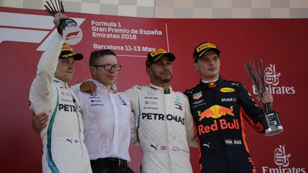 Winner Mercedes driver Lewis Hamilton of Britain, second from right, stands on the podium with second place Mercedes driver Valtteri Bottas of Finland, left and third place Red Bull driver Max Verstappen of the Netherlands, after the Spanish Formula One Grand Prix at the Barcelona Catalunya racetrack in Montmelo, Spain, on Sunday.(AP)