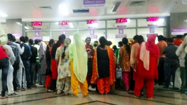 Patients queued up outside the OPD at the Kalpana Chawla Government Medical College and Hospital in Karnal.(HT Photo)