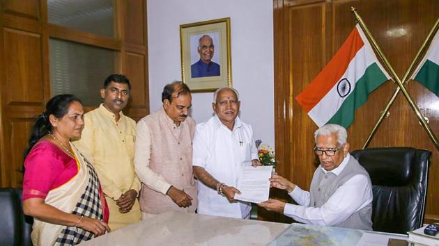 BJP's chief ministerial candidate B S Yeddyurappa meets Karnataka Governor Vajubhai Vala after the Karnataka Assembly election 2018 results, in Bengaluru on Tuesday. He met the Governor again on Wednesday after being elected the BJP legislative party chief. (PTI) BJP's chief ministerial candidate B S Yeddyurappa meets Karnataka Governor Vajubhai Vala after the Karnataka Assembly election 2018 results, in Bengaluru on Tuesday. He met the Governor again on Wednesday after being elected the BJP legislative party chief. (PTI)