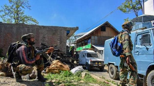 Security personnel stand guard during an encounter between security forces and militants at Drabgam in Pulwama District of South Kashmir. (PTI) Security personnel stand guard during an encounter between security forces and militants at Drabgam in Pulwama District of South Kashmir. (PTI)