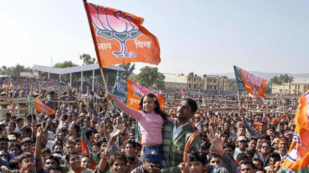 A child waves a BJP flag during a public meeting in Ajmer. (HT File Photo) A child waves a BJP flag during a public meeting in Ajmer. (HT File Photo)