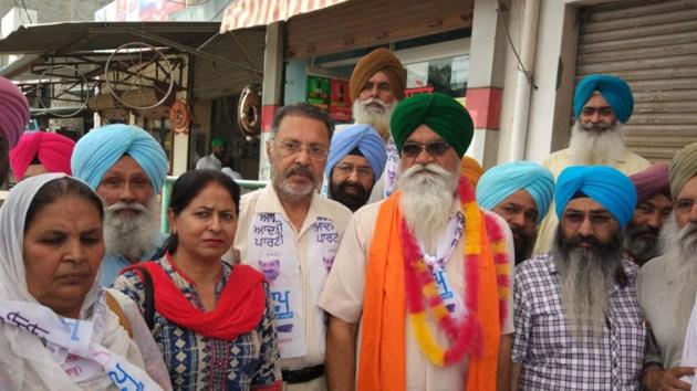 AAP candidate for Shahkot bypoll , Rattan Singh Kakkar with party supporters during his campaign at Shahkot on Wednesday. (HT Photo)