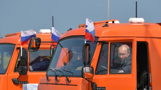 Russian President Vladimir Putin on a Kamaz truck during a ceremony to open a bridge, constructed to connect the Russian mainland with the Crimean peninsula. (Reuters) Russian President Vladimir Putin on a Kamaz truck during a ceremony to open a bridge, constructed to connect the Russian mainland with the Crimean peninsula. (Reuters)