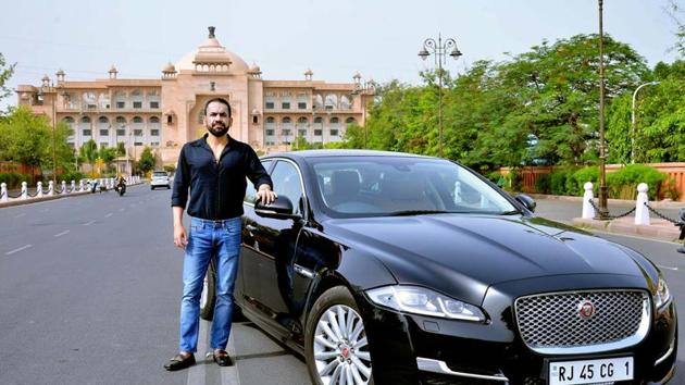 Rrahul Tanejaa with his Jaguar with premium number 1.(HT PHOTO)