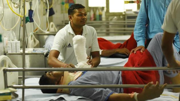An injured man receives treatment at a hospital after an under construction flyover collapsed in Varanasi on Tuesday. At least 18 persons died and several others were feared trapped in the rubble after a portion of the overhead bridge collapsed in the Cantonment area of Varanasi. (Subhankar Chakraborty / HT Photo) An injured man receives treatment at a hospital after an under construction flyover collapsed in Varanasi on Tuesday. At least 18 persons died and several others were feared trapped in the rubble after a portion of the overhead bridge collapsed in the Cantonment area of Varanasi. (Subhankar Chakraborty / HT Photo)