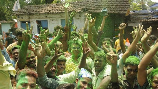 Trinamool Congress supporters celebrate in front of Bratachari Bidyashram counting centre at Joka, South Kolkata on May 17. The party was heading for control of over 80% of the gram panchayats and 90% of the panchayat samitis. It was also leading in all 20 zila parishads. BJP was a very distant second, while the Left and Congress were pushed to the margins. (Samir Jana / HT Photo) Trinamool Congress supporters celebrate in front of Bratachari Bidyashram counting centre at Joka, South Kolkata on May 17. The party was heading for control of over 80% of the gram panchayats and 90% of the panchayat samitis. It was also leading in all 20 zila parishads. BJP was a very distant second, while the Left and Congress were pushed to the margins. (Samir Jana / HT Photo)