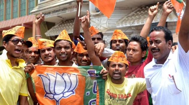 BJP workers in Jhargram celebrating victory on Thursday.(HT Photo)