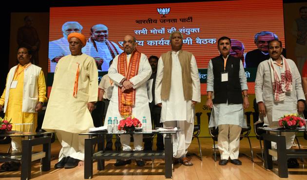 BJP National President Amit Shah with Bhadohi MP Virendra Singh and BJP General Secretary Ram Lal during the inauguration of the combined ‘BJP National Executive Committee meeting of all the morchas (cells)’ at Civic Centre in New Delhi on Thursday. (Sonu Mehta / HT Photo) BJP National President Amit Shah with Bhadohi MP Virendra Singh and BJP General Secretary Ram Lal during the inauguration of the combined ‘BJP National Executive Committee meeting of all the morchas (cells)’ at Civic Centre in New Delhi on Thursday. (Sonu Mehta / HT Photo)