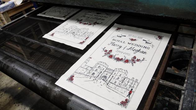 Tea towels by Victoria Eggs to commemorate the wedding go through a drying machine at Countryside Art Ltd in Spilsby, England. The Centre for Retail Research estimates that £30 million of memorabilia will be sold to mark the wedding. (Jack Taylor / Getty Images)