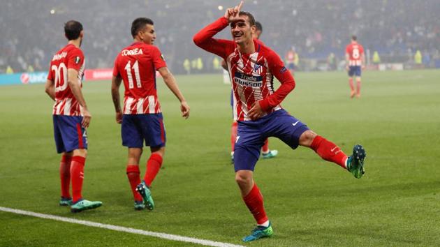 Griezmann celebrates scoring the goal that all but ended the game. (REUTERS)