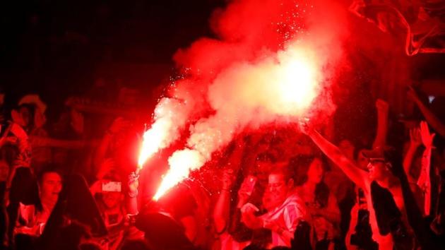 Atletico fans broke out the flares in celebration of their triumph. (REUTERS)