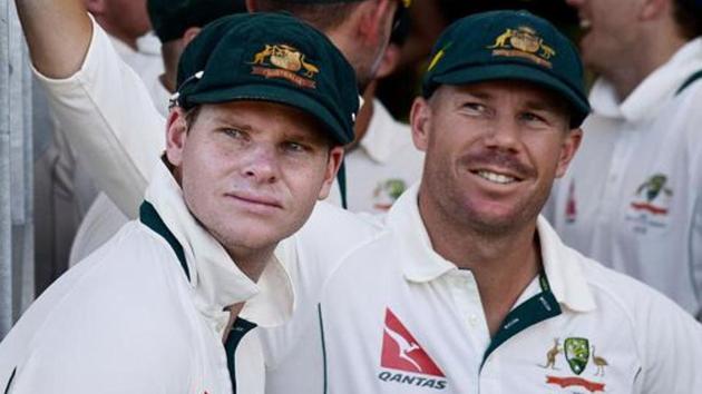 David Warner (R)and Steve Smith have been banned for one year each for being involved in ball-tampering during Australia’s third Test against South Africa in March.(AFP)