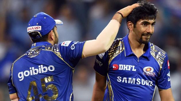 Mumbai Indians skipper Rohit Sharma and bowler Jasprit Bumrah celebrate the wicket of Kings XI Punjab batsman Aaron Finch during the IPL 2018 match on Wednesday.(PTI)