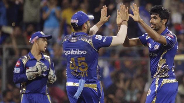 Mumbai Indians’ Jasprit Bumrah, right, celebrate the dismissal of King XI Punjab's Marcus Stoinis with teammates during an Indian Premier League (IPL) 2018 match on Wednesday.(AP)