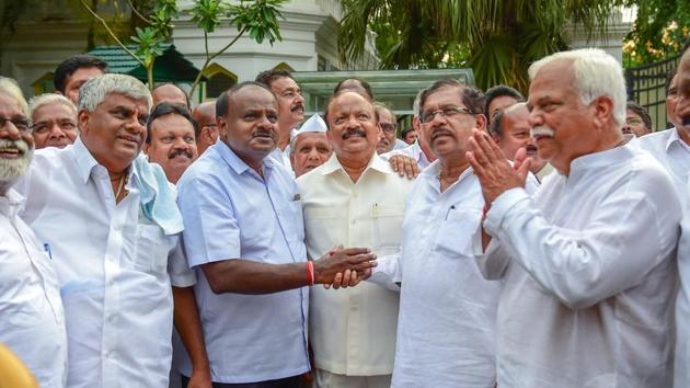 JD(S) President HD Kumaraswamy greets KPCC President G Parameshwara after meeting with Governor to stake claim to form the coalition government in the state on Wednesday. The BJP emerged as the largest party and the Congress was voted out of power on Tuesday. But the political situation changed when the Congress and JD(S) announced a surprise alliance. (Shailendra Bhojak / PTI)
