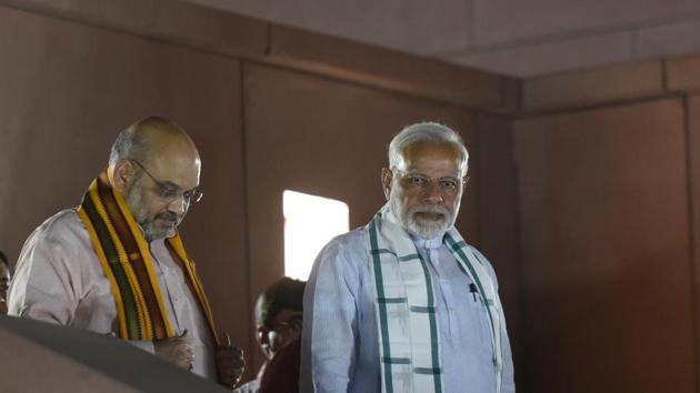 PM Narendra Modi and BJP president Amit Shah at the party’s headquarters after Karnataka assembly election results, in New Delhi, on May 15, 2018. (Vipin Kumar/HT Photo) PM Narendra Modi and BJP president Amit Shah at the party’s headquarters after Karnataka assembly election results, in New Delhi, on May 15, 2018. (Vipin Kumar/HT Photo)