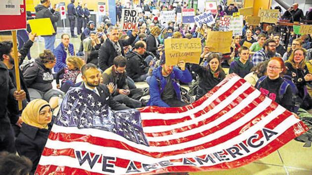 Demonstrators sit in the concourse at Seattle-Tacoma International Airport in Seattle. (AP File Photo) Demonstrators sit in the concourse at Seattle-Tacoma International Airport in Seattle. (AP File Photo)