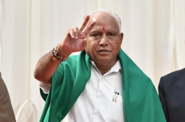 Newly sworn-in Karnataka chief minister BS Yeddyurappa flashes victory sign at the oath ceremony in Bengaluru on Thursday. He said that he was “100% sure” of winning the vote of confidence in the assembly and completing the five-year term. Yeddyurappa slammed the Congress-JDS alliance as “unholy” and charged they were out to grab power though the people had “rejected them outright”. (Arijit Sen / HT Photo) Newly sworn-in Karnataka chief minister BS Yeddyurappa flashes victory sign at the oath ceremony in Bengaluru on Thursday. He said that he was “100% sure” of winning the vote of confidence in the assembly and completing the five-year term. Yeddyurappa slammed the Congress-JDS alliance as “unholy” and charged they were out to grab power though the people had “rejected them outright”. (Arijit Sen / HT Photo)