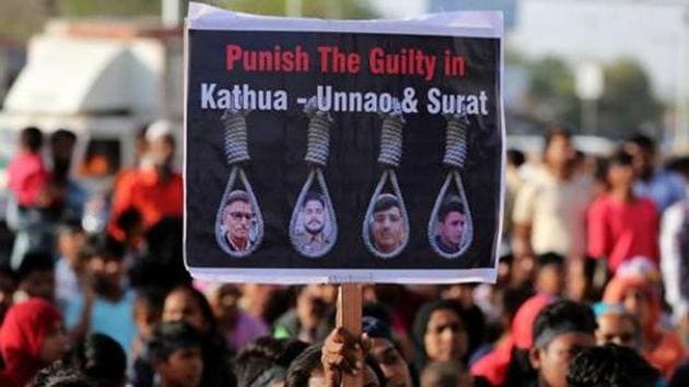 People hold placards at a protest against the rape of an eight-year-old girl, in Kathua, near Jammu, a teenager in Unnao, Uttar Pradesh state, and an eleven-year-old girl in Surat.(REUTERS File Photo)