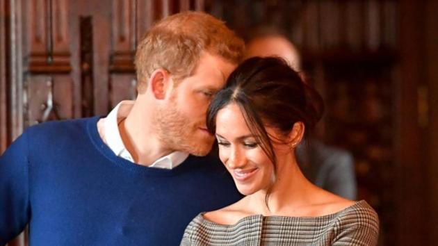 Britain's Prince Harry whispers to Meghan Markle as they watch a performance by a Welsh choir in the banqueting hall during a visit to Cardiff Castle in Cardiff, Britain. (Reuters File Photo) Britain's Prince Harry whispers to Meghan Markle as they watch a performance by a Welsh choir in the banqueting hall during a visit to Cardiff Castle in Cardiff, Britain. (Reuters File Photo)