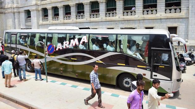 Congress MLAs leave the Vidhana Soudha in a bus after staging a protest dharna against the swearing-in of B S Yeddyurappa as Karnataka chief minister, in Bengaluru on Thursday. (PTI) Congress MLAs leave the Vidhana Soudha in a bus after staging a protest dharna against the swearing-in of B S Yeddyurappa as Karnataka chief minister, in Bengaluru on Thursday. (PTI)