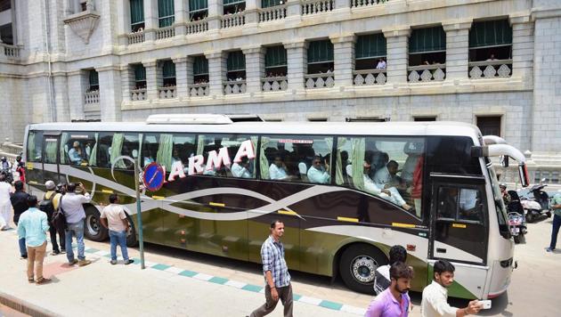 Congress MLAs, sit in a bus after staging a protest against the swearing-in of BS Yeddyurappa as Karnataka chief minister, in Bengaluru. (PTI File Photo) Congress MLAs, sit in a bus after staging a protest against the swearing-in of BS Yeddyurappa as Karnataka chief minister, in Bengaluru. (PTI File Photo)