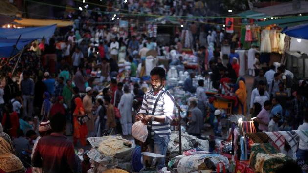 A vendor packs up vermicelli for a customer outside the Jama Masjid  in Old Delhi, India. The month brings markets alive especially in the evenings with sweetmeats and trinkets of all sorts. To prepare for the fast, Muslims wake in the night for a pre-dawn meal called “suhoor.” (Adnan Abidi / REUTERS) 