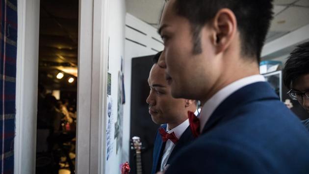 Both aged 34, So and Chan say their Christian upbringings made them feel they had to keep their sexual identities and their relationship a secret. Chan says he still is not comfortable enough to come out to his parents like So. Their pastor has been trying to enable same-sex couples in Hong Kong to enjoy a wedding celebration despite the pressures and prejudices. (Dale De La Rey / AFP) Both aged 34, So and Chan say their Christian upbringings made them feel they had to keep their sexual identities and their relationship a secret. Chan says he still is not comfortable enough to come out to his parents like So. Their pastor has been trying to enable same-sex couples in Hong Kong to enjoy a wedding celebration despite the pressures and prejudices. (Dale De La Rey / AFP)