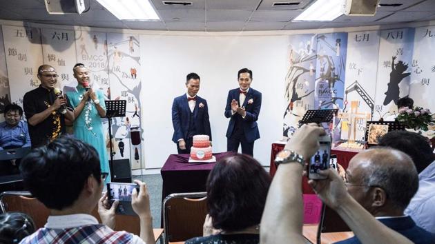 Pang said he has married more than 50 gay couples in Hong Kong, now conducting one or two same-sex weddings each month, up from just one in 2015. Homosexuality was only decriminalised in Hong Kong in 1991, and despite a vibrant gay scene and an annual pride parade, conservative attitudes still run deep in Chinese traditions. (Dale De La Rey / AFP) Pang said he has married more than 50 gay couples in Hong Kong, now conducting one or two same-sex weddings each month, up from just one in 2015. Homosexuality was only decriminalised in Hong Kong in 1991, and despite a vibrant gay scene and an annual pride parade, conservative attitudes still run deep in Chinese traditions. (Dale De La Rey / AFP)