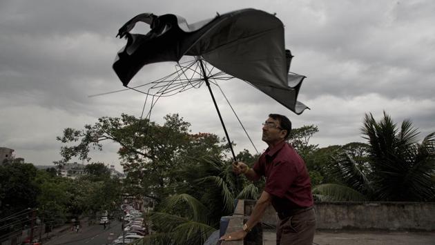 A man’s umbrella gives way under strong wind blowing in Guwahati, Assam, on May 15, 2018. (Anupam Nath / AP) A man’s umbrella gives way under strong wind blowing in Guwahati, Assam, on May 15, 2018. (Anupam Nath / AP)