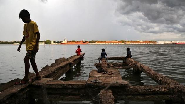 A boy walks through a damaged jetty as pre-monsoon clouds gather above the Vembanad Lake in Kochi, Kerala on May 11, 2018. (Sivaram V / REUTERS) A boy walks through a damaged jetty as pre-monsoon clouds gather above the Vembanad Lake in Kochi, Kerala on May 11, 2018. (Sivaram V / REUTERS)