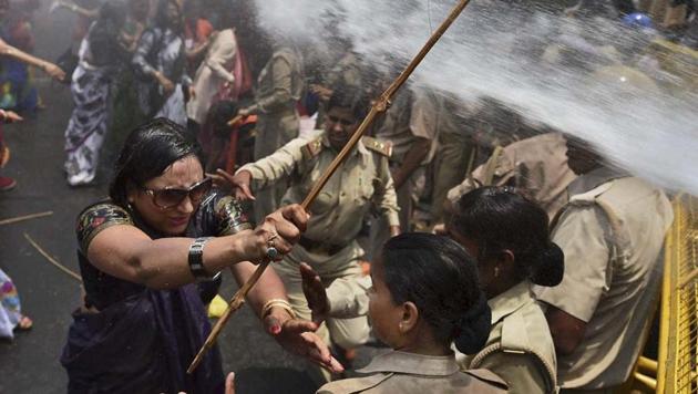 Policewomen in action during a violent agitation over the 2014 Badaun gang rape case.(AP File) Policewomen in action during a violent agitation over the 2014 Badaun gang rape case.(AP File)