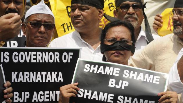 Supporters of West Bengal Pradesh Congress (WPCC) in Kolkata joined Congress supporters in various parts of the country in observing ‘Save Democracy Day’, protesting against Karnataka governor Vajubhai inviting BJP leader BS Yeddyurappa to take oath as chief minister following a split verdict in that state. (Samir Jana / HT Photo) Supporters of West Bengal Pradesh Congress (WPCC) in Kolkata joined Congress supporters in various parts of the country in observing ‘Save Democracy Day’, protesting against Karnataka governor Vajubhai inviting BJP leader BS Yeddyurappa to take oath as chief minister following a split verdict in that state. (Samir Jana / HT Photo)