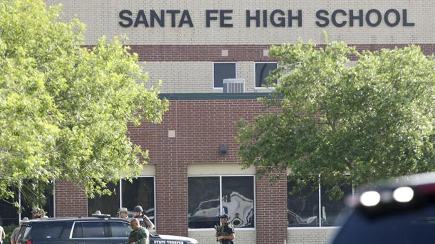 Law enforcement officers respond to Santa Fe High School after an active shooter was reported on campus, Friday, May 18, 2018, in Santa Fe, Texas.(AP)