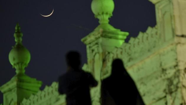 The crescent appears in the backdrop of Haji Ali Dargah in Mumbai, Maharashtra, on May 17, 2018. (Ragul Krishnan / HT Photo) The crescent appears in the backdrop of Haji Ali Dargah in Mumbai, Maharashtra, on May 17, 2018. (Ragul Krishnan / HT Photo)