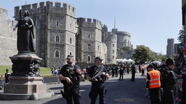 Armed police secure the route of the carriage procession. Around 4,000 police personnel are said to have been called into Windsor for the event. (Frank Augustein / Pool via AP) Armed police secure the route of the carriage procession. Around 4,000 police personnel are said to have been called into Windsor for the event. (Frank Augustein / Pool via AP)